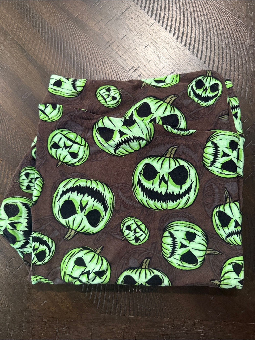 LuLaRoe Brown Leggings with Neon Green Jack-O'-Lantern Print
